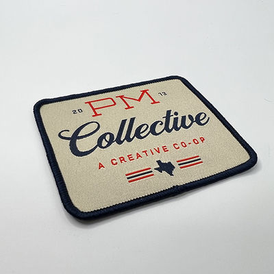 Изготовленный на заказ утюг логотипа на сплетенной заплате Washable Emroidery латает лазер отрезал границу для одежды